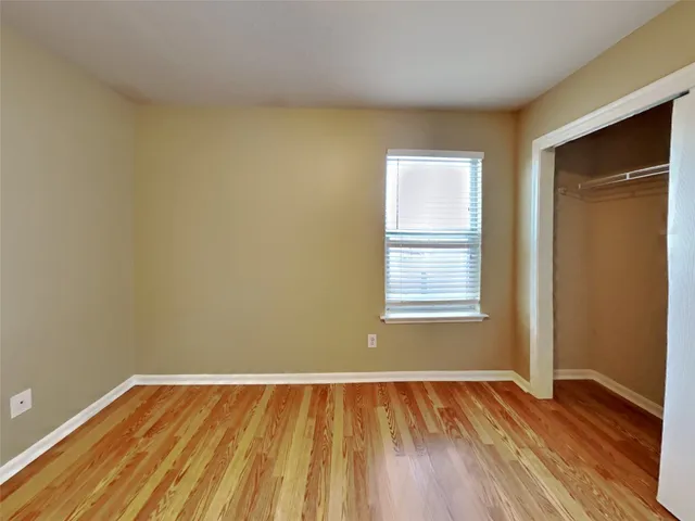 a view of a porch with wooden fence
