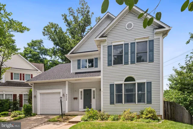 a front view of a house with a yard porch and furniture