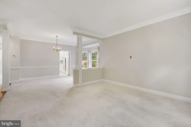 an empty room with a empty space and windows