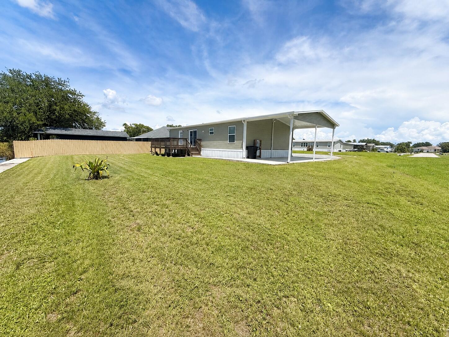 1121 Orange Loop Okeechobee, FL 34974 - Photo 30 of 33 Sunny Backyard with Manufactured Home an
