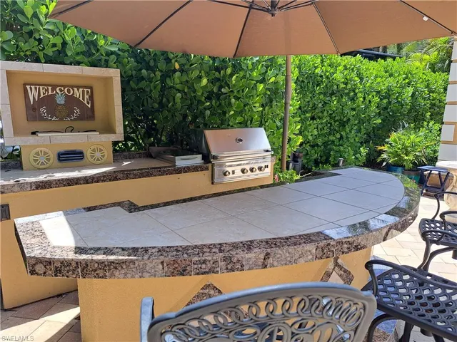 swimming pool view with a seating space