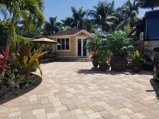 a view of house with yard outdoor seating and entertaining space