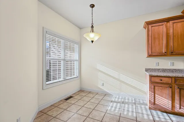 a large bathroom with a sink a mirror and a shower