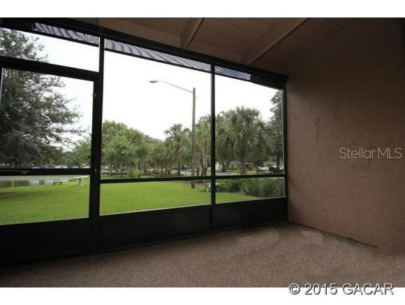 501 Southwest 75th Street, Unit J1 Gainesville, FL 32607 - Photo 12 of 12 a view of an outdoor space with a large window