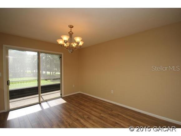 501 Southwest 75th Street, Unit J1 Gainesville, FL 32607 - Photo 3 of 12 a view of an empty room with a window