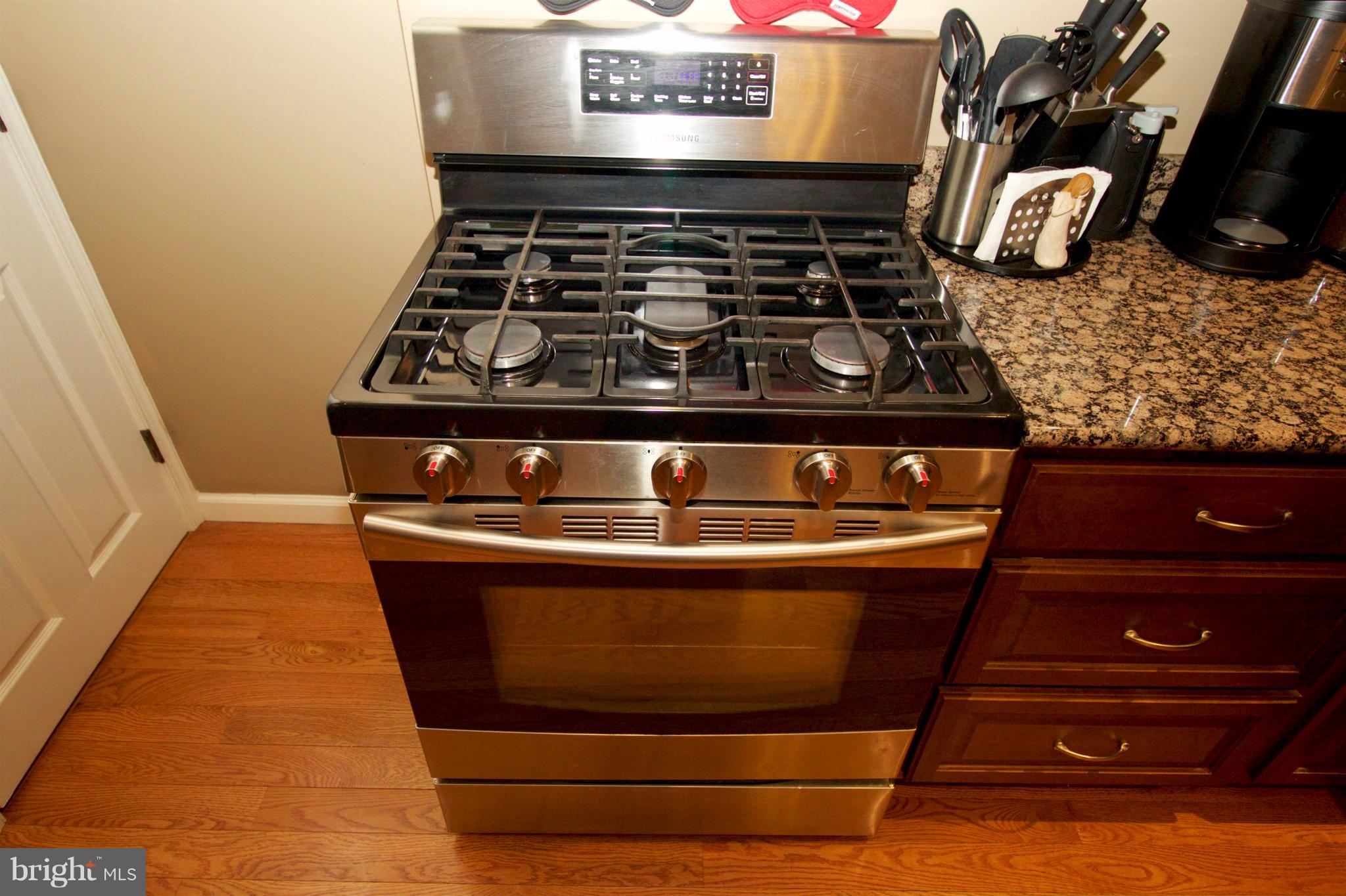 512 Old Riverside Road Baltimore, MD 21225 - Photo 14 of 38 a stove top oven sitting inside of a kitchen