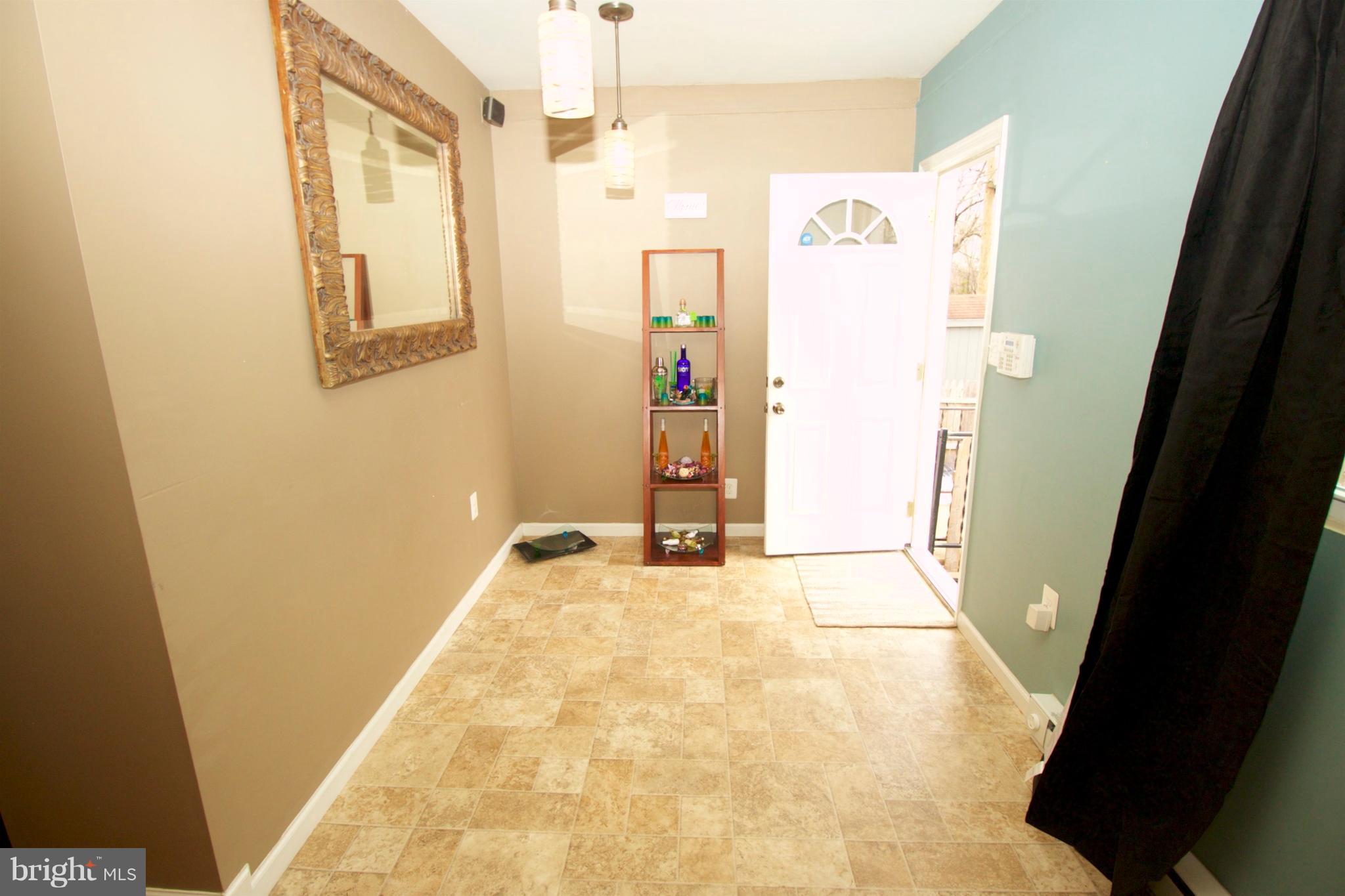 512 Old Riverside Road Baltimore, MD 21225 - Photo 15 of 38 a view of a hallway with wooden floor and cabinet