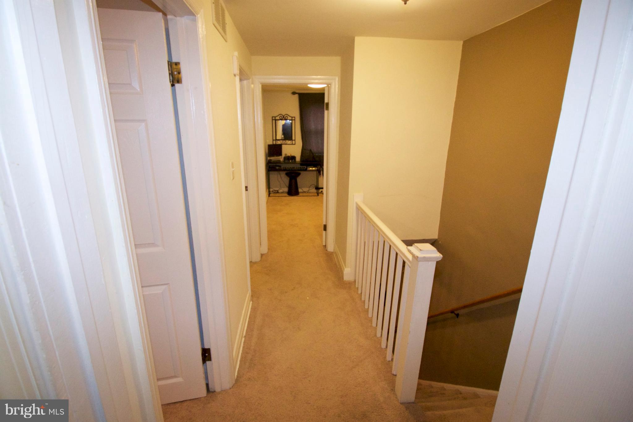 512 Old Riverside Road Baltimore, MD 21225 - Photo 19 of 38 a view of a hallway with a door