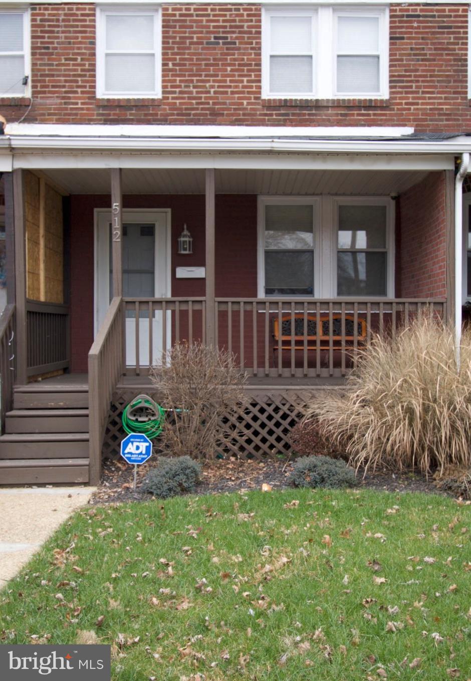 512 Old Riverside Road Baltimore, MD 21225 - Photo 2 of 38 a front view of a house with a garden