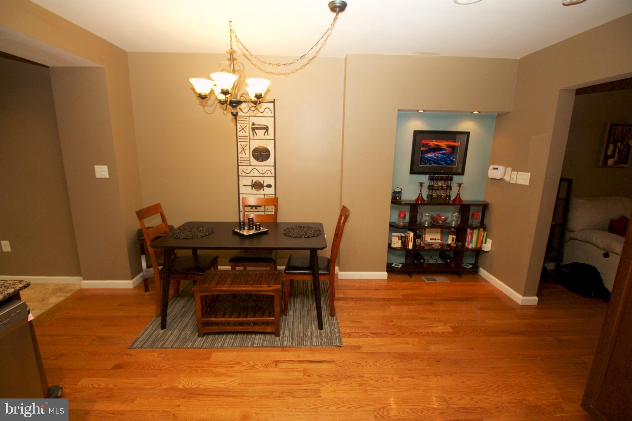 512 Old Riverside Road Baltimore, MD 21225 - Photo 8 of 38 a dining room with furniture and wooden floor