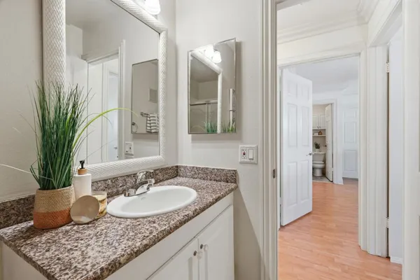 a bathroom with sink and mirror