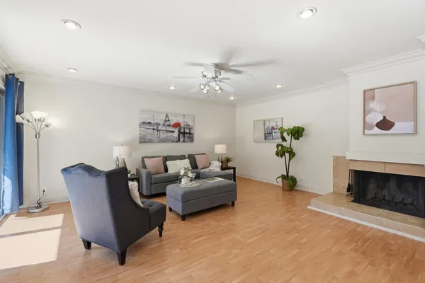 a living room with furniture and a fireplace