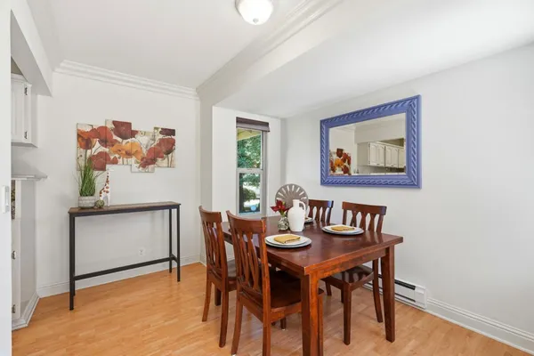 a view of a dining room with furniture and window