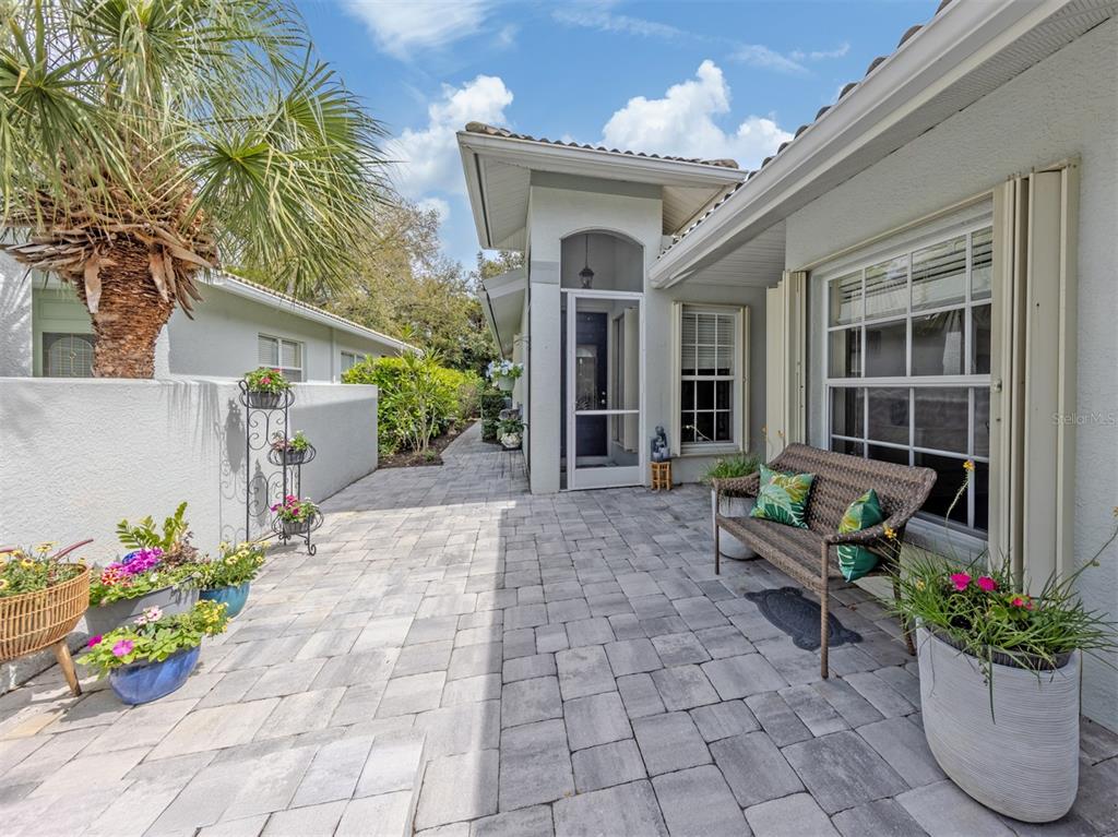 205 Reclinata Circle Venice, FL 34292 - Photo 5 of 62 a front view of a house with a garden
