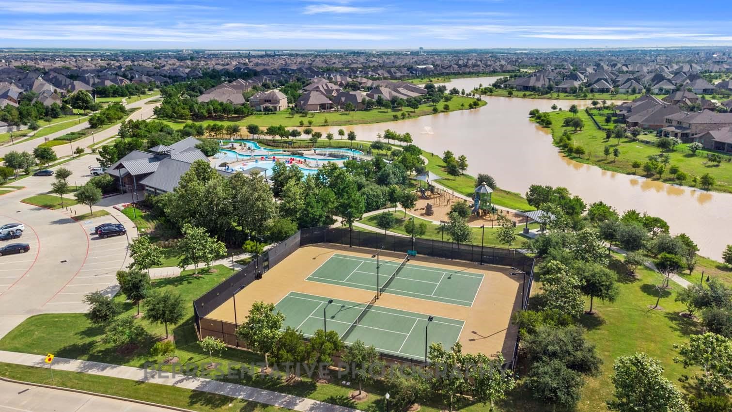 2719 Russell Meadows Lane Fulshear, TX 77423 - Photo 21 of 23 an aerial view of a house with a lake view