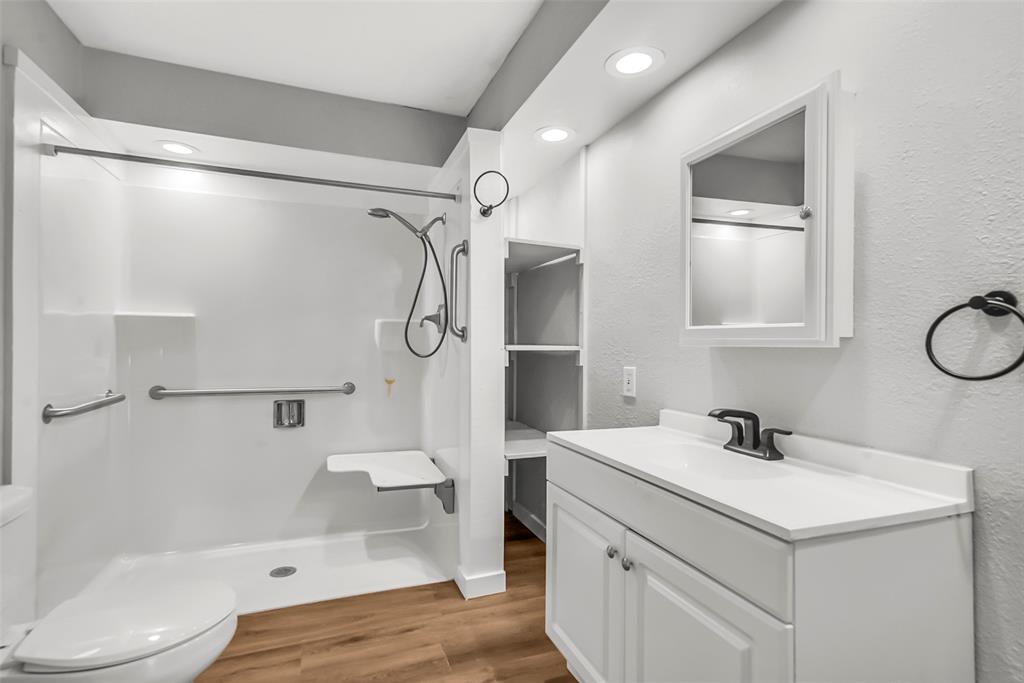 820 Lipscomb Street Bonham, TX 75418 - Photo 19 of 31 a bathroom with a sink toilet and shower