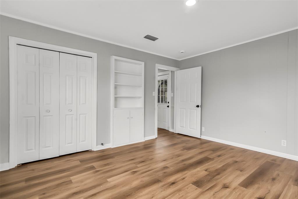 820 Lipscomb Street Bonham, TX 75418 - Photo 26 of 31 a view of an empty room with wooden floor