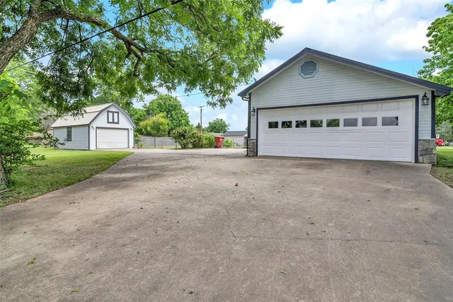 a view of a backyard with a garden and plants