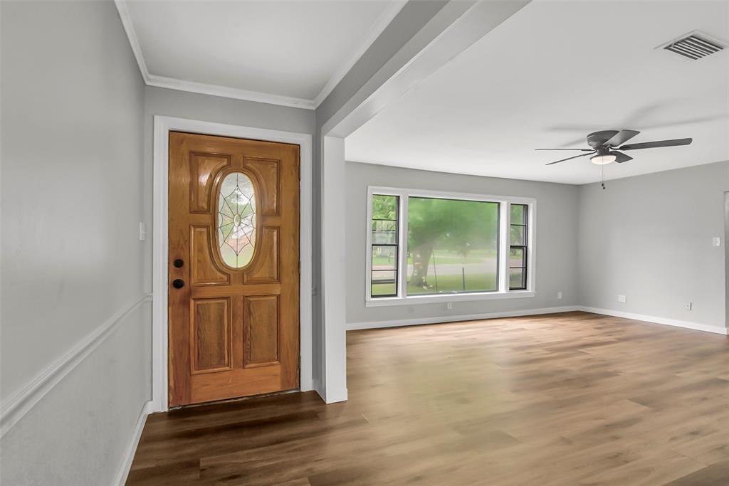 820 Lipscomb Street Bonham, TX 75418 - Photo 6 of 31 a view of an entryway with wooden floor