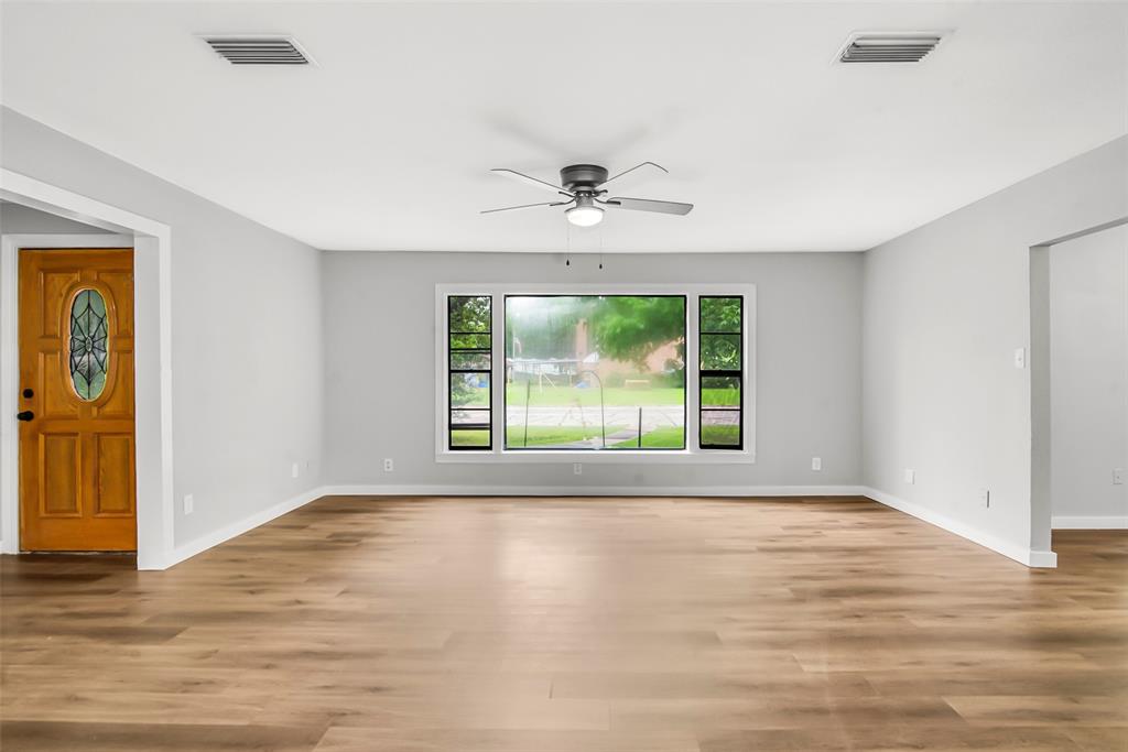820 Lipscomb Street Bonham, TX 75418 - Photo 7 of 31 a view of an empty room with a window