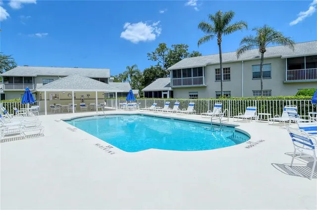 a view of pool with outdoor seating