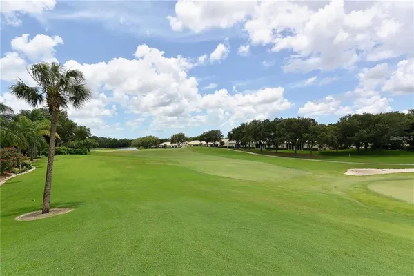 a view of a golf course with a lake