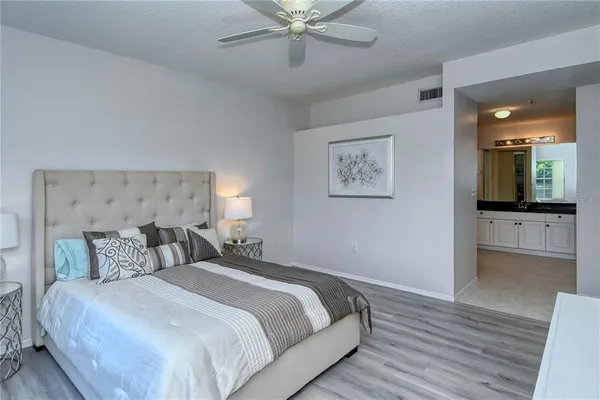 a bedroom with bed and window