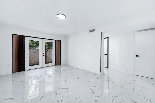 a view of a bathroom from a hallway