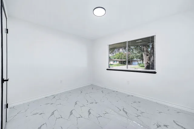 an empty room with windows