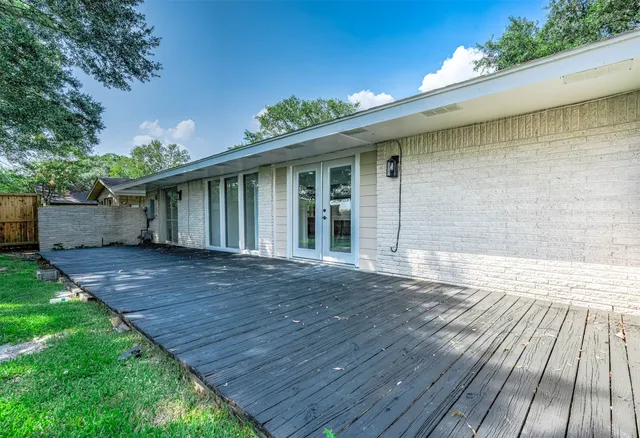 a backyard of a house with lots of green space