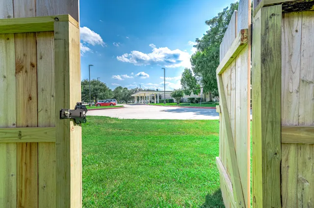a view of house with a yard