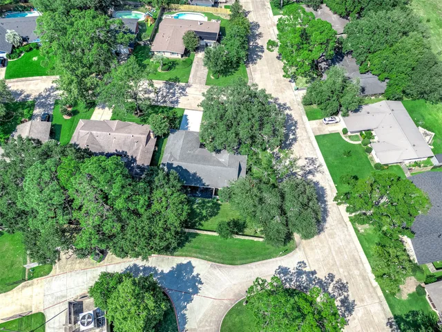 an aerial view of residential house with outdoor space and swimming pool