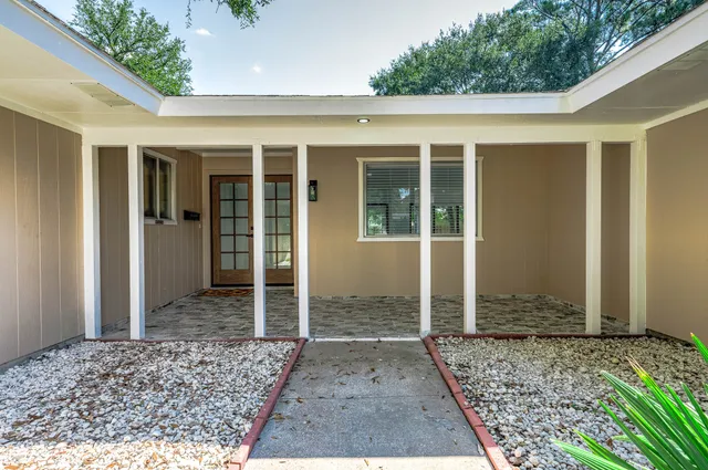 a aerial view of a house with a yard
