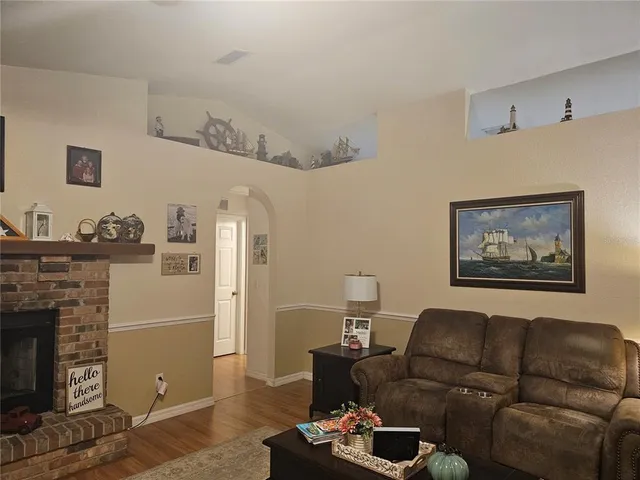 a kitchen with stainless steel appliances a stove refrigerator sink and cabinets