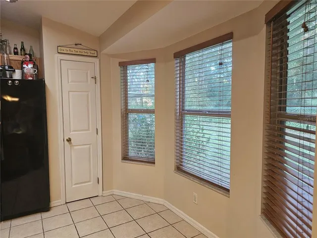 a kitchen with appliances a sink and cabinets