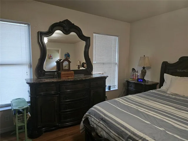 a bathroom with a sink a toilet and shower curtain