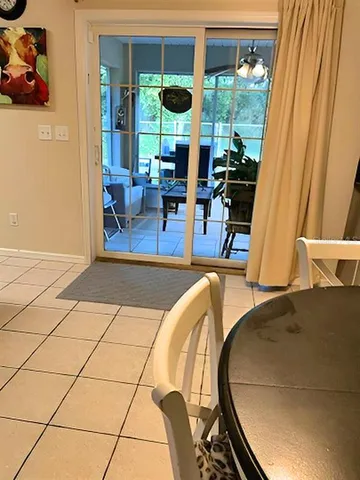a view of kitchen with furniture and large window