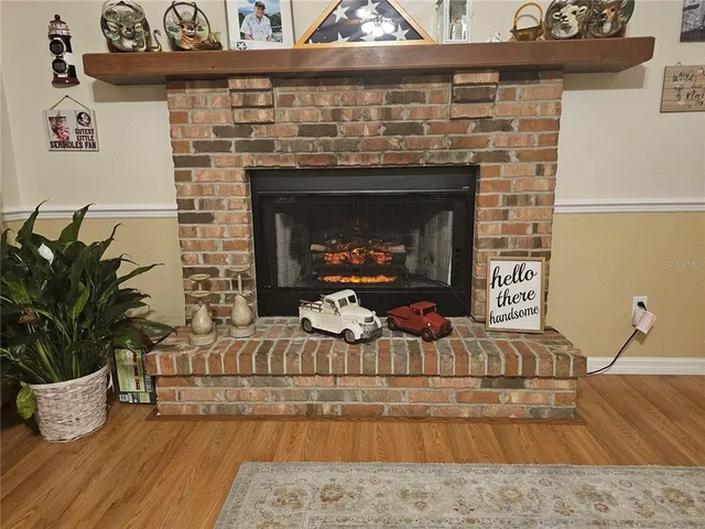 a living room with furniture a rug and a chandelier