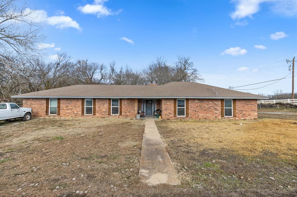 14391 Us Highway Van Alstyne, TX 75495 - Photo 1 of 1 a front view of a house with yard