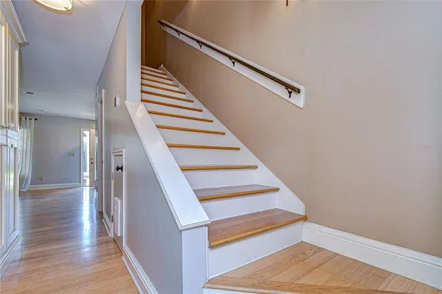 an empty room with closet and a ceiling fan