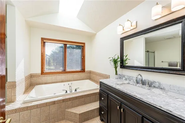 a living room with furniture a rug and a window