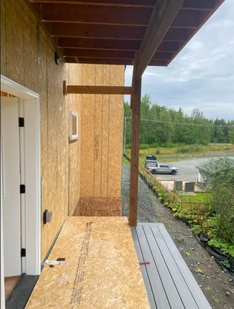 a view of balcony with wooden floor