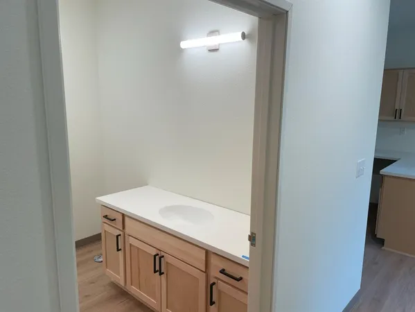 a bathroom with a sink and a mirror