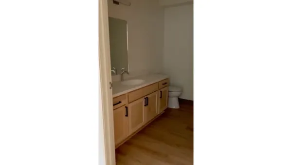 a hallway with cabinets