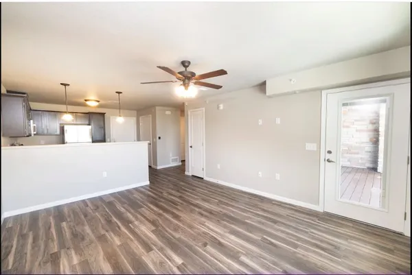 a view of a kitchen cabinets and a wooden floor