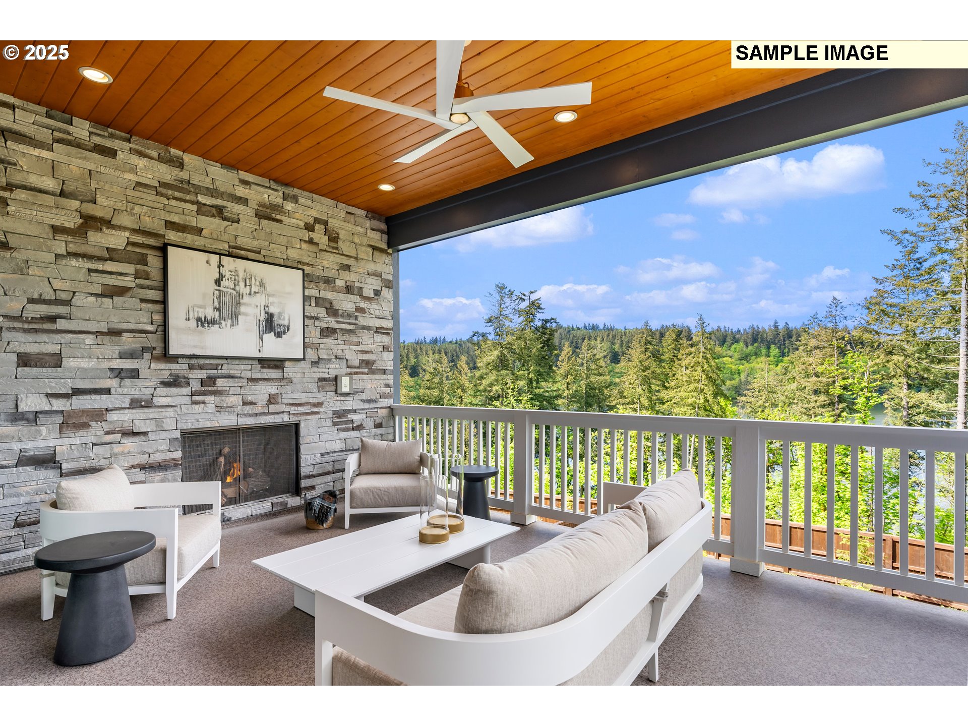 526 North Z Circle Washougal, WA 98671 - Photo 9 of 15 a balcony with furniture and a fireplace