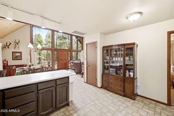 a spacious bathroom with a sink double vanity and a large mirror
