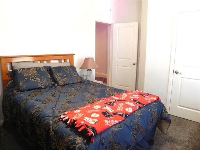 a bedroom with a bed and a closet