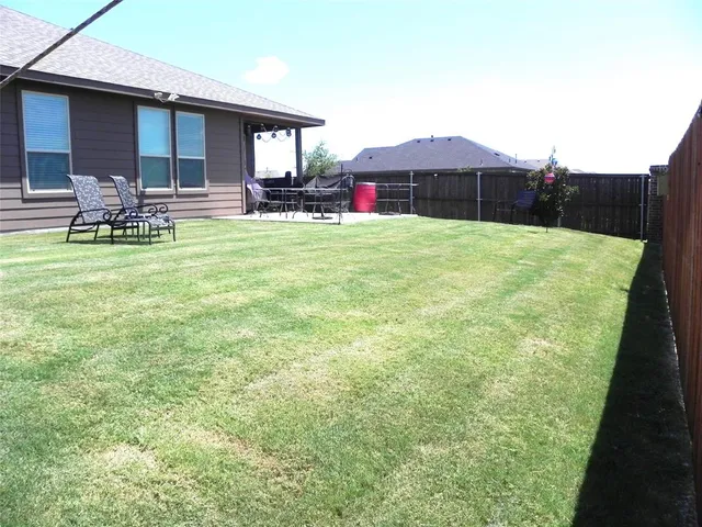a front view of house with outdoor space and seating area
