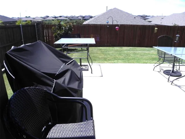 a terrace of a house with garden and patio